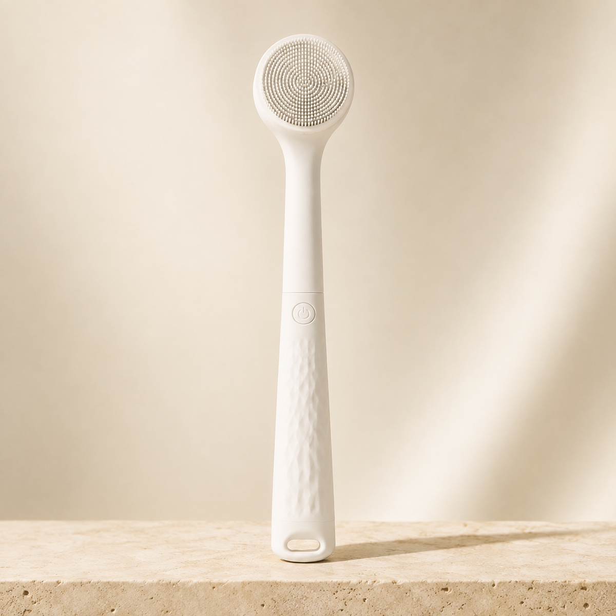 White Bristlewell electric body brush standing upright against a plain warm backdrop